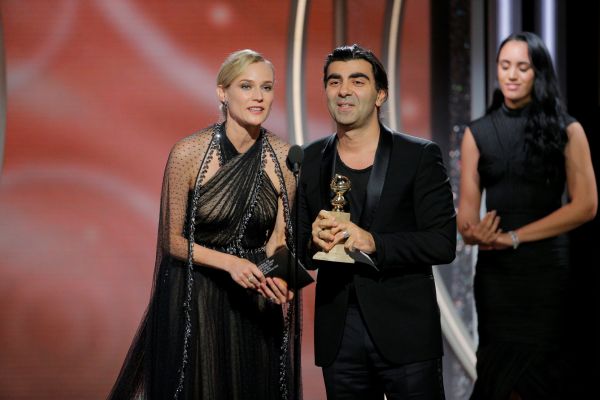 Fatih Akin, director/producer, "In the Fade" accepts the award for Best Motion Picture Foreign Language with actress Diane Kruger at the 75th Golden Globe Awards in Beverly Hills